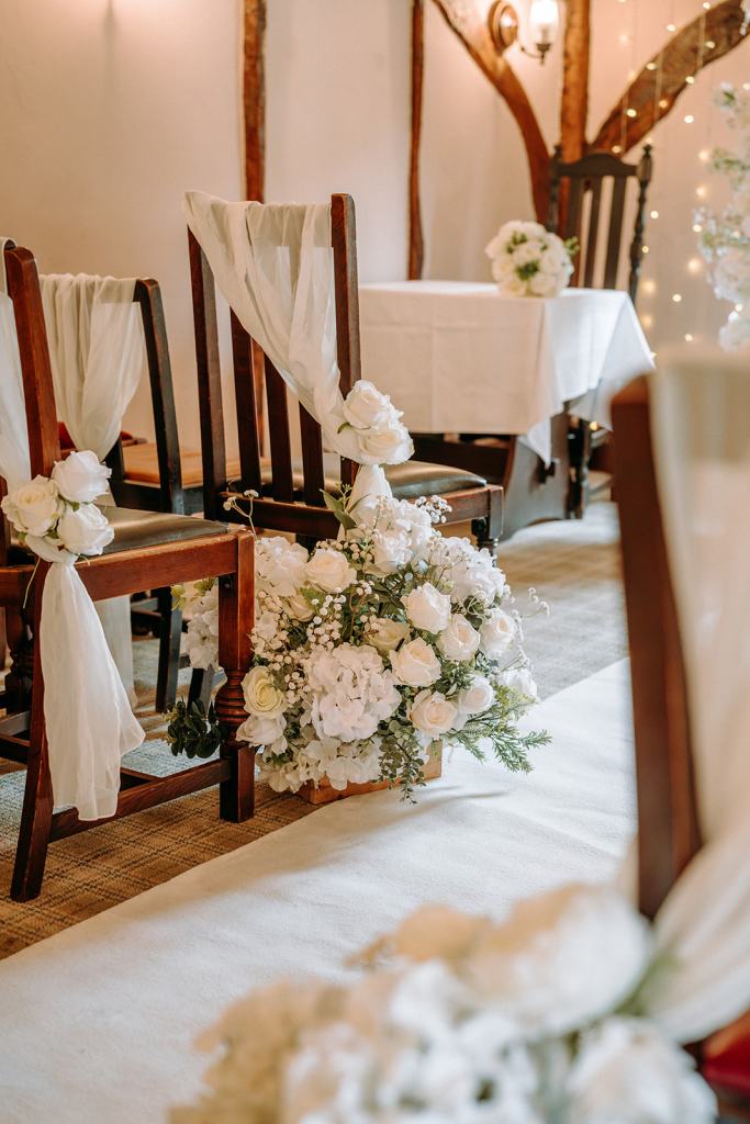 Wedding ceremony area decorated with romantic florals and thoughtful styling